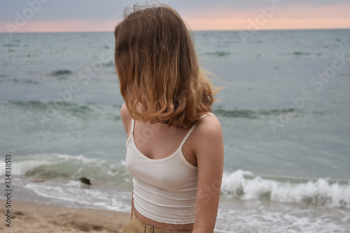  girl on a background of blue sea