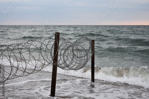 barbed fence in the sea