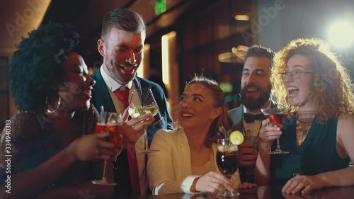Friends having fun in a cocktail bar photo