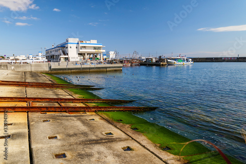 Kobe Tarumi Port, a port with waves and a sky photo
