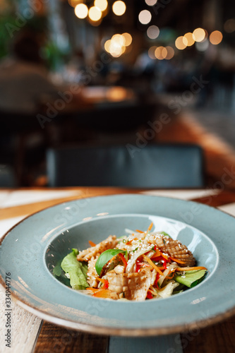 plate with salad on a table in a restaurant