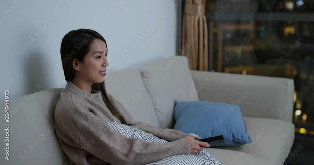 Woman watch tv at home Woman watch tv at home