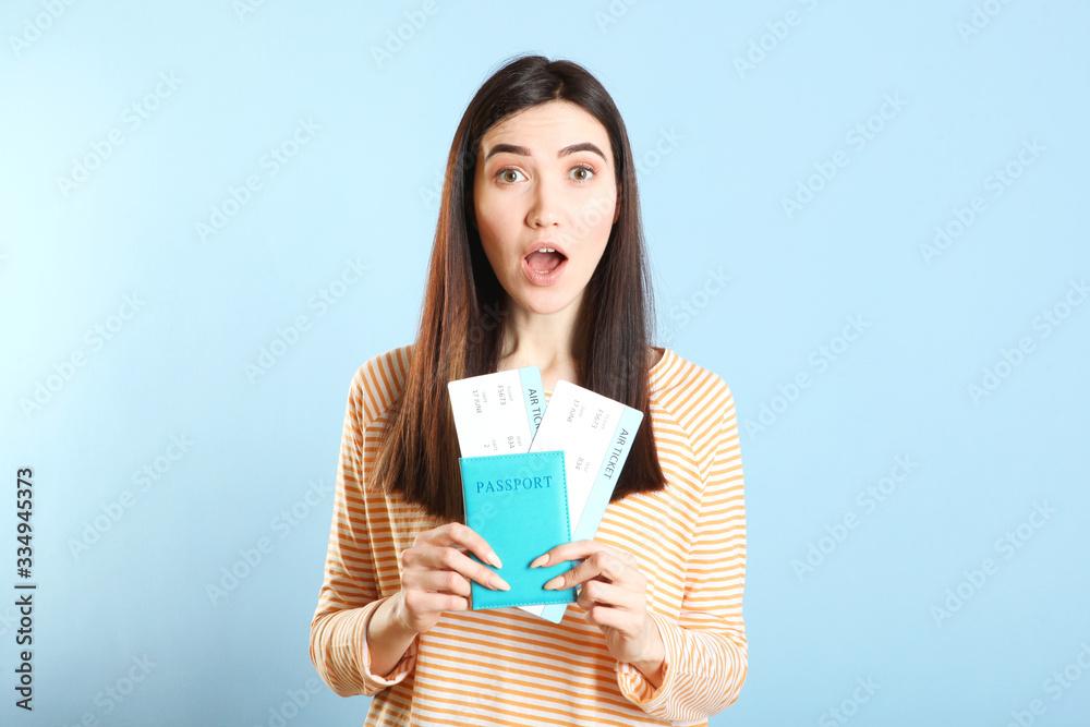 Beautiful young smiling girl holds tickets for travel. Rest, travel, tour. Beautiful young smiling girl holds tickets for travel. Rest, travel, tour.