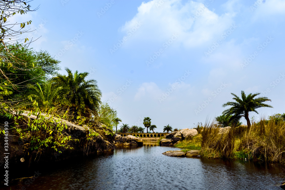 urban Indian landscape with rivers, stones and bridge