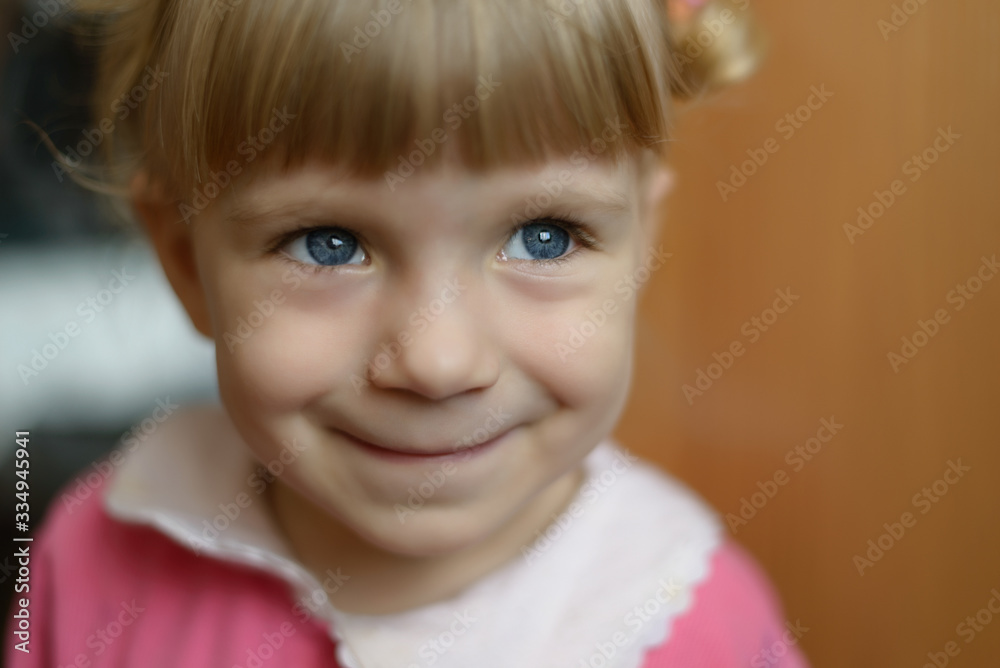 Close-up portrait of adorable smiling little girl. Selective focus with shallow depth of field. Close-up portrait of adorable smiling little girl. Selective focus with shallow depth of field.