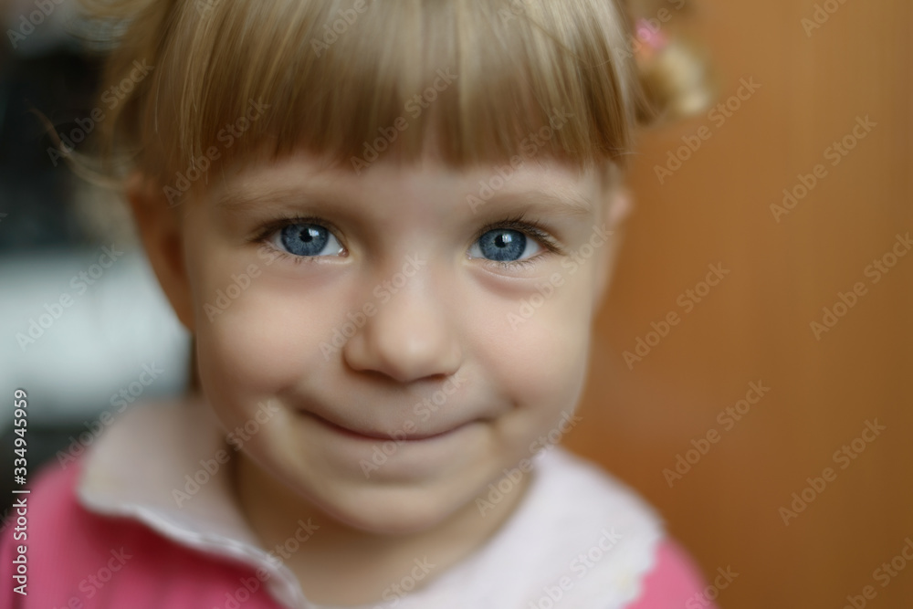 Close-up portrait of adorable smiling little girl. Selective focus with shallow depth of field. Close-up portrait of adorable smiling little girl. Selective focus with shallow depth of field.