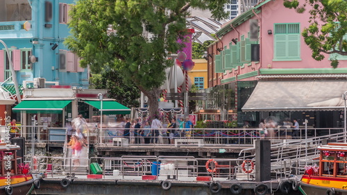 Tourist boats docking at Clarke Quay habour timelapse.