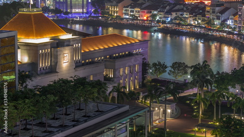 Photography Parliament House in downtown Singapore aerial night timelapse and boat quay in the background