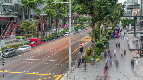 Aerial view of sidewalk and intersection of Orchard road in Singapore timelapse. photo