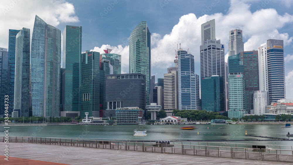 Fototapeta premium Business Financial Downtown City and Skyscrapers Tower Building w Marina Bay timelapse hyperlapse, Singapur,