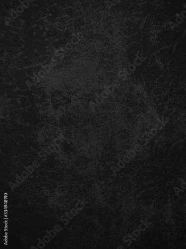 Dark concrete texture wall background. Black grunge cement wall texture for interior design. Copy space for add text.