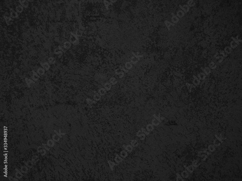 Dark concrete texture wall background. Black grunge cement wall texture for interior design. Copy space for add text.