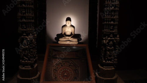 Mumbai, Maharastra/India- March 31 2020: Idol of sitting lord Mahavira- worshipped by the people of Jain religion. photo