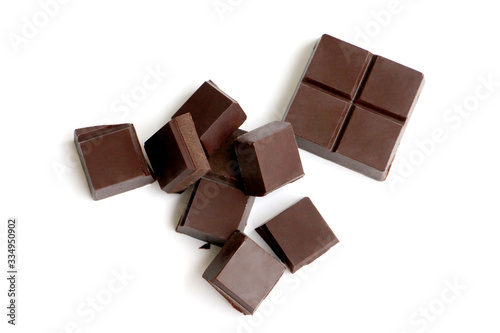 A pile of milk chocolate slab blocks broken up and stacked