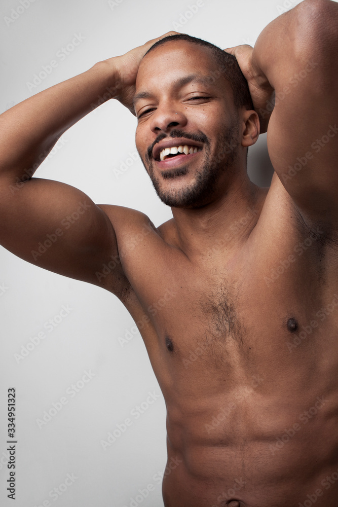 Vertical portrait of bearded black handsome guy grooming himself. Vertical portrait of bearded black handsome guy grooming himself.