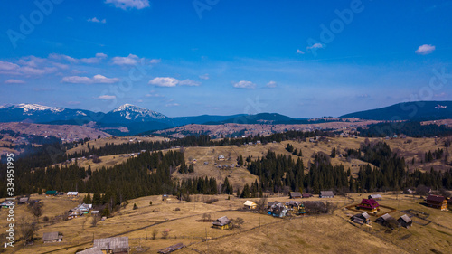 Alpine village settlement of a house on top of a mountain aerial photo Carpathians Ukraine.