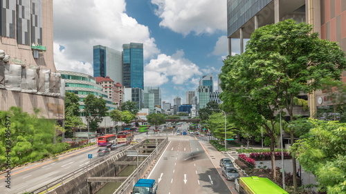 Traffic with cars on a street and urban scene in the central district of Singapore timelapse
