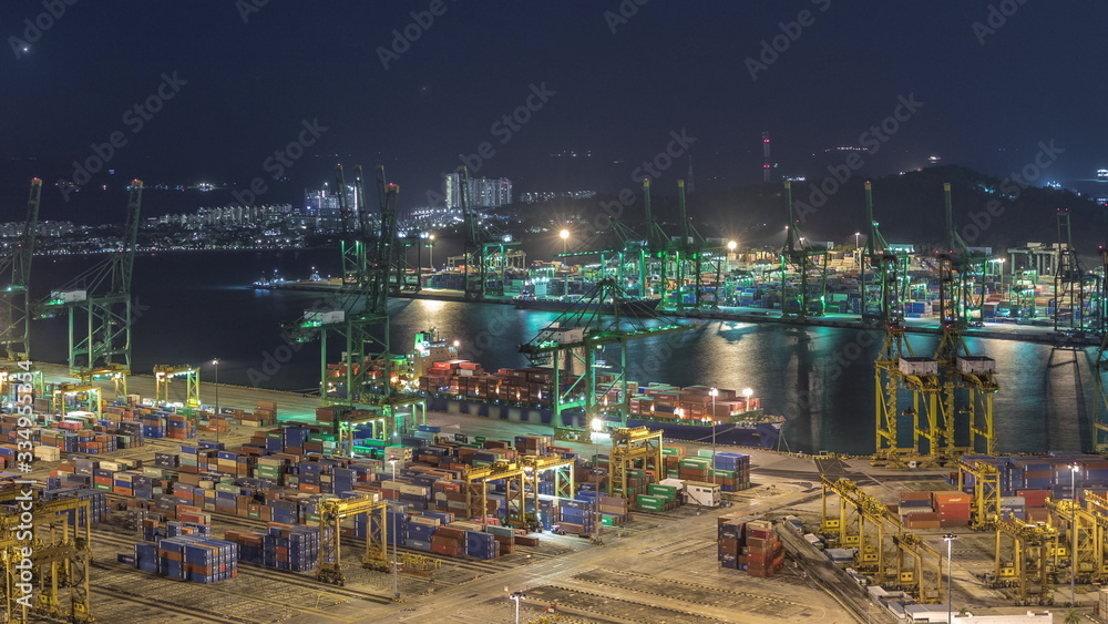 Fototapeta premium Commercial port of Singapore aerial night timelapse.