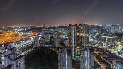 City skyline with commercial port of Singapore aerial night timelapse. © neiezhmakov