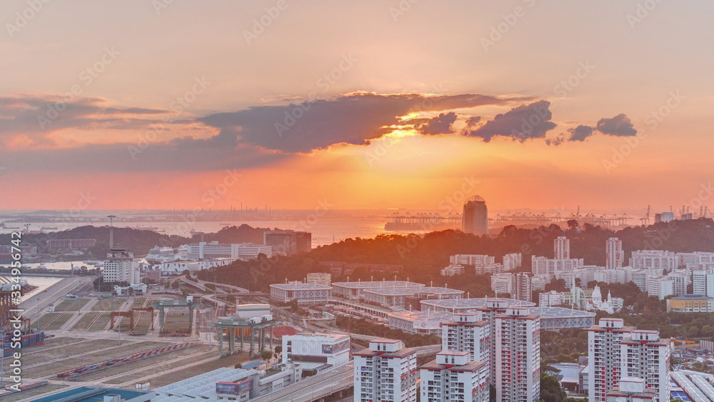 Obraz premium Sunset over commercial port of Singapore timelapse.
