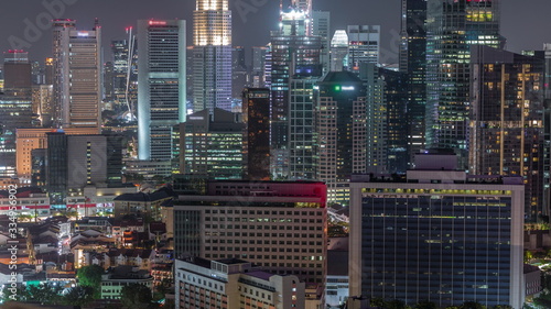 Aerial cityscape of Singapore downtown of modern architecture with skyscrapers night timelapse