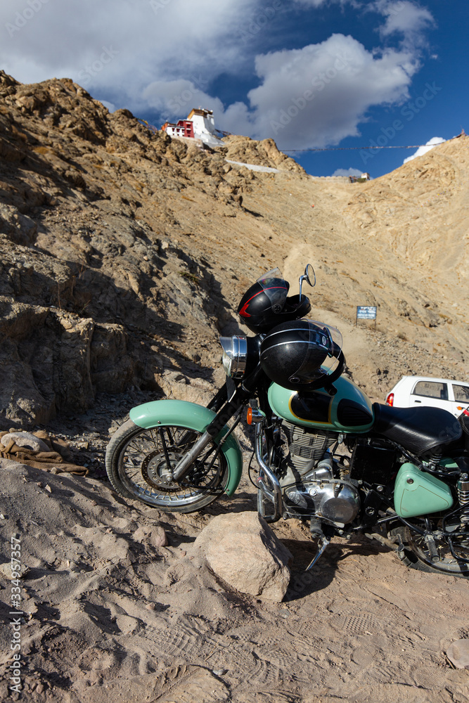 Motorbikes with beautiful sky, clouds, mountains view and leh palace background. Motorcycle trip in Leh, Ladakh, India. Motorbikes with beautiful sky, clouds, mountains view and leh palace background. Motorcycle trip in Leh, Ladakh, India.