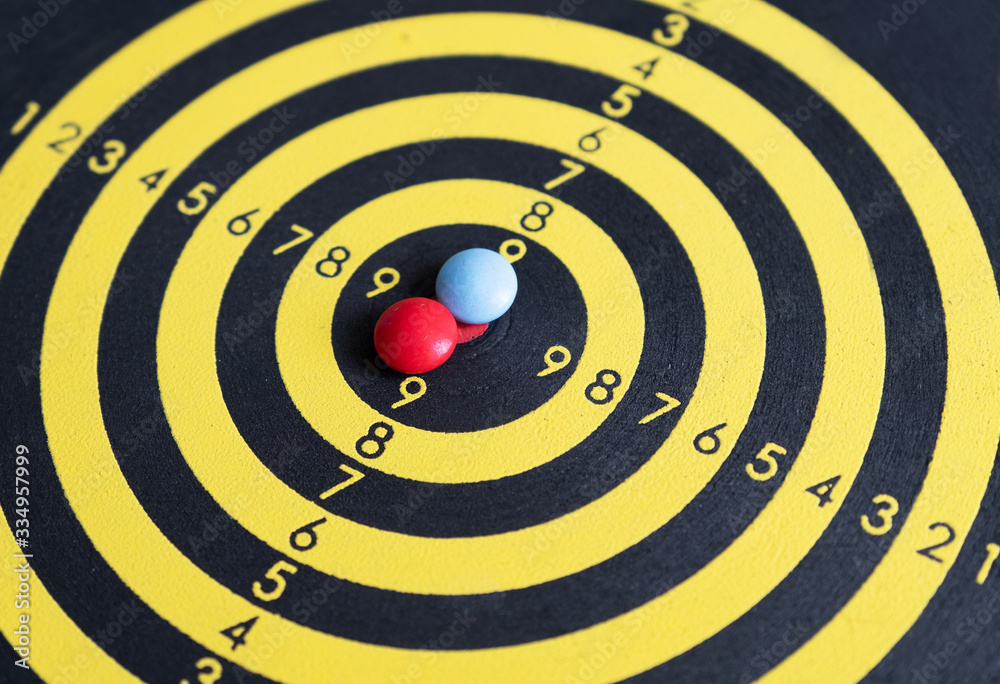 tablets lying in the center of the dart board. Close-up.