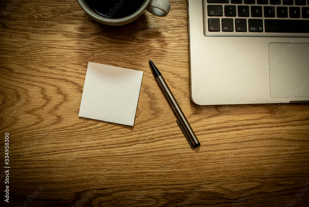 Note Book with pen coffee and computer