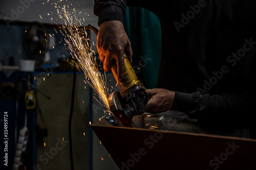 Worker welding in a factory