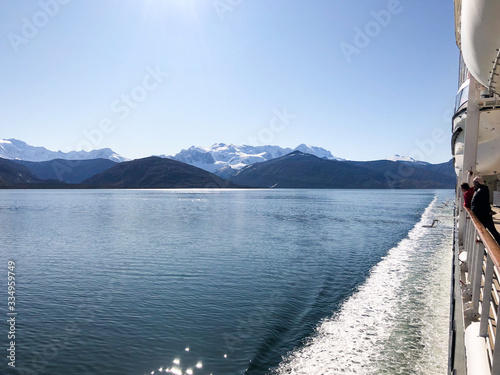 Breathtaking landscape and scenery with mountains, glaciers and fjords on sunny day during cruising on luxury cruise ship or cruiseship liner in the Beagle Channel in Patagonia between Argentina Chile photo