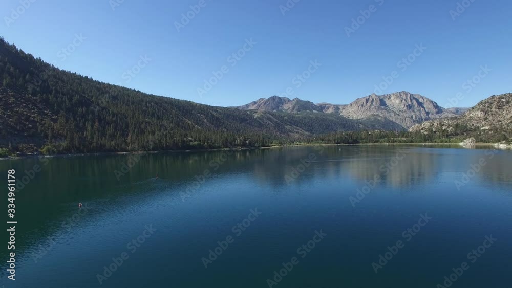 Aerial shot. Flight over June Lake. Beautiful landscape of wonderful lake forest and mountains. Amazing lake in summertime. Shooting in 4K video. Cinematic Aerial Footage of June Lake California USA Aerial shot. Flight over June Lake. Beautiful landscape of wonderful lake forest and mountains. Amazing lake in summertime. Shooting in 4K video. Cinematic Aerial Footage of June Lake California USA