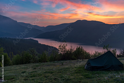 Tent on sunset. Amazing camping location in Rhodope mountains next to Arda river and Kardzhali town, Bulgaria