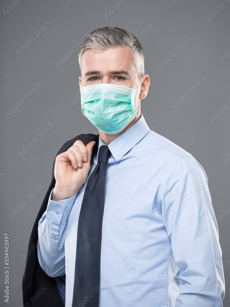 Businessman wearing a mask in a Covid-19 concept Businessman wearing a mask in a Covid-19 concept