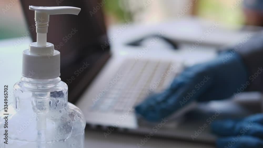 Worker disinfects and cleans the laptop and keyboard with antibacterial wet wipes to protect against corona virus covid-19 during pandemic outbreak. Hygiene and virus prevention at work or at home Worker disinfects and cleans the laptop and keyboard with antibacterial wet wipes to protect against corona virus covid-19 during pandemic outbreak. Hygiene and virus prevention at work or at home
