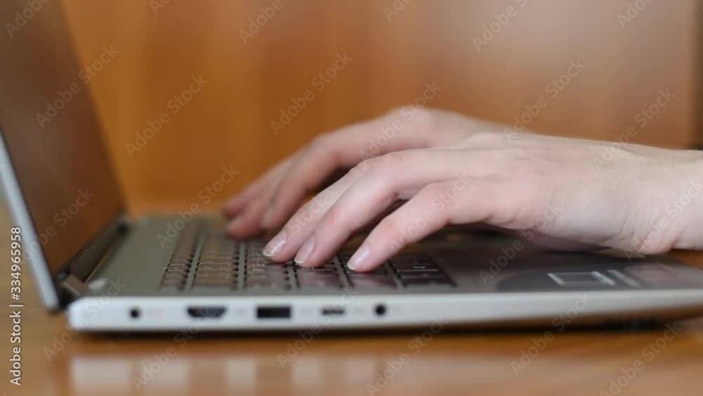 Closeup shot of hands typing on laptop keyboard Closeup shot of hands typing on laptop keyboard