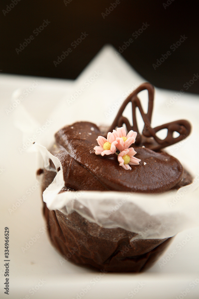 Chocolate brownie with pink frosting flowers Chocolate brownie with pink frosting flowers