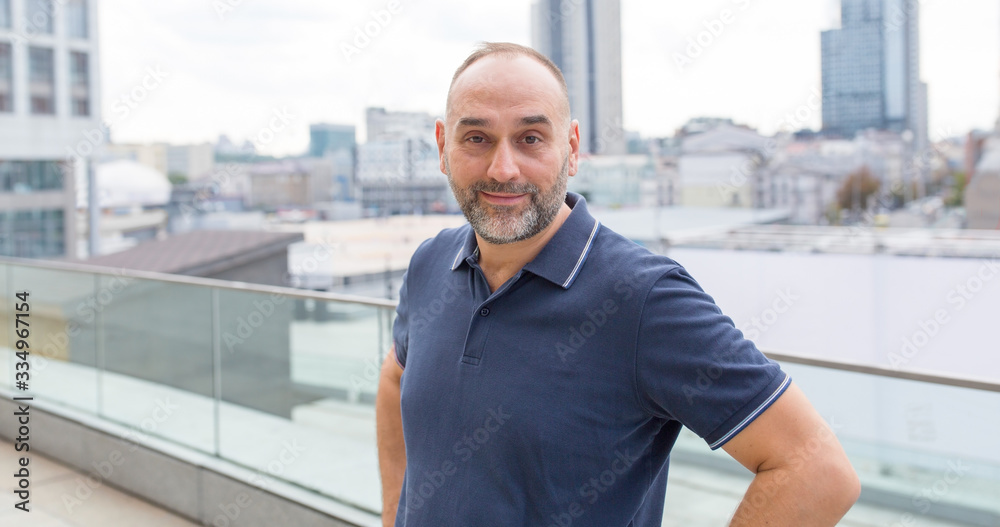 © A Stock Studio - Portrait of a middle aged man on a city street background. © A Stock Studio - Portrait of a middle aged man on a city street background.