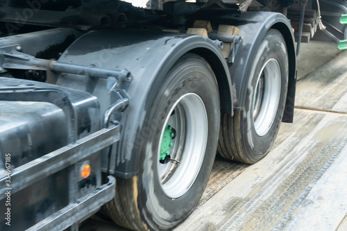 Fast-moving images of truck wheels in transportation.