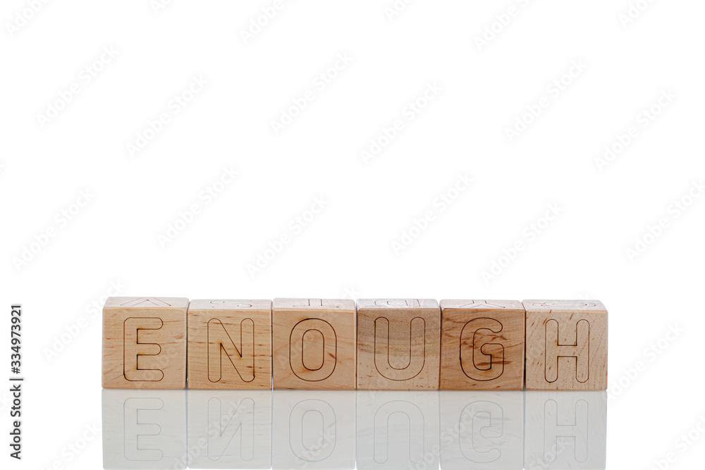 Wooden cubes with letters enough on a white background