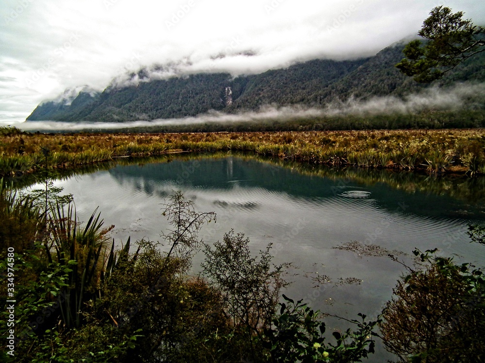 Reflective lake with Earl mountains, New Zealand Reflective lake with Earl mountains, New Zealand