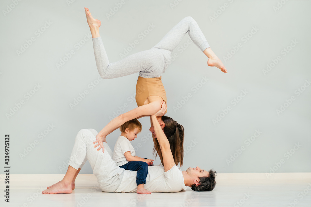 Premium Photo | Young couple practicing yoga together. man and woman  standing near on mat, doing balance pose and stretching, copy space. partner  yoga concept