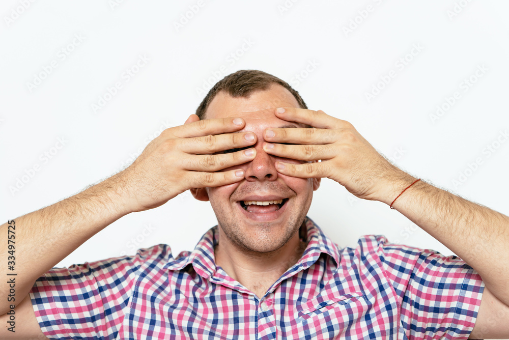 Man closes eyes with her hands Man closes eyes with her hands