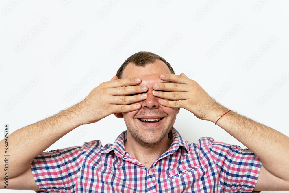 Man closes eyes with her hands Man closes eyes with her hands
