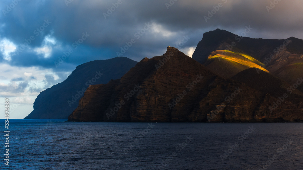 view from the sea with the eastern coast of St. Helena island in the Atlantic Ocean