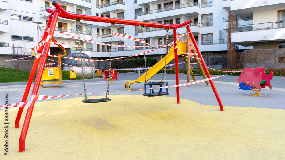 Children's playground is closed. No children on the Playground in the yard.Prevention of coronavirus COVID-19. Ban on children 's playgrounds. The fight against the virus. Children's playground is closed. No children on the Playground in the yard.Prevention of coronavirus COVID-19. Ban on children 's playgrounds. The fight against the virus.