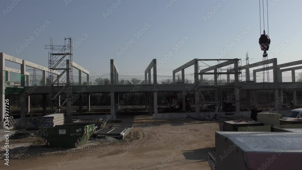 a huge company building is erected on a large construction site a huge company building is erected on a large construction site