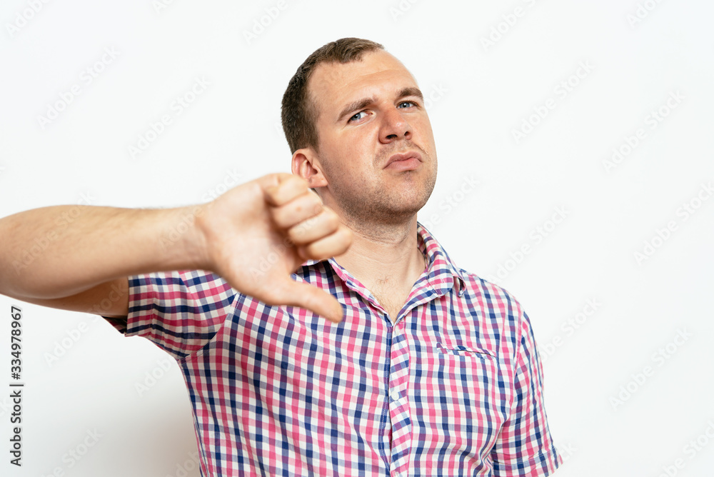 man showing a thumb down gesture