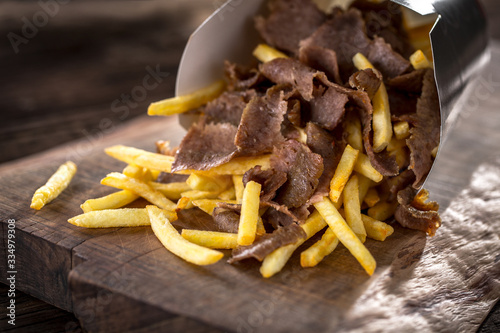kebab and chips in a take away box