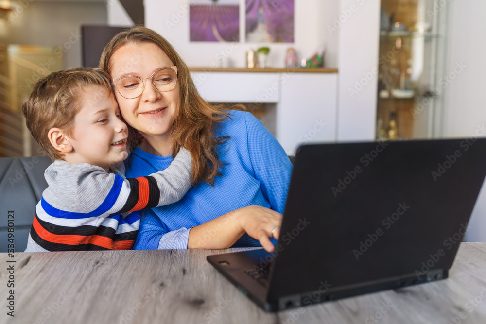 Mother and son learning together on the computer with fun Mother and son learning together on the computer with fun