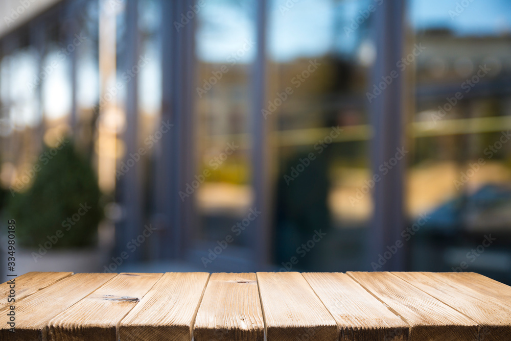 Empty tropical wood table and blurred garden cafe light background. product display template.Business presentation Empty tropical wood table and blurred garden cafe light background. product display template.Business presentation